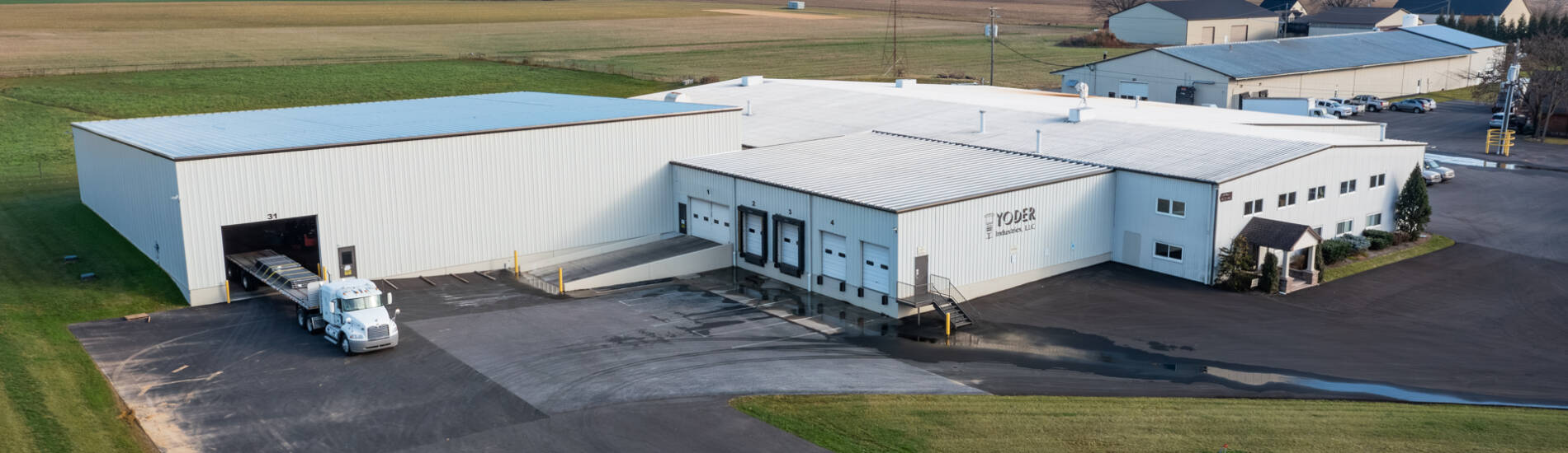 An exterior drone photo of Yoder Industries metal laser cutting and forming shop in Lancaster, PA.