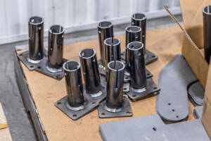 A photo of some metal parts that have been welded by Yoder Industries.